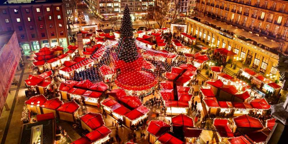 Top view of christmas market stalls with a lot of people - best christmas markets in the world