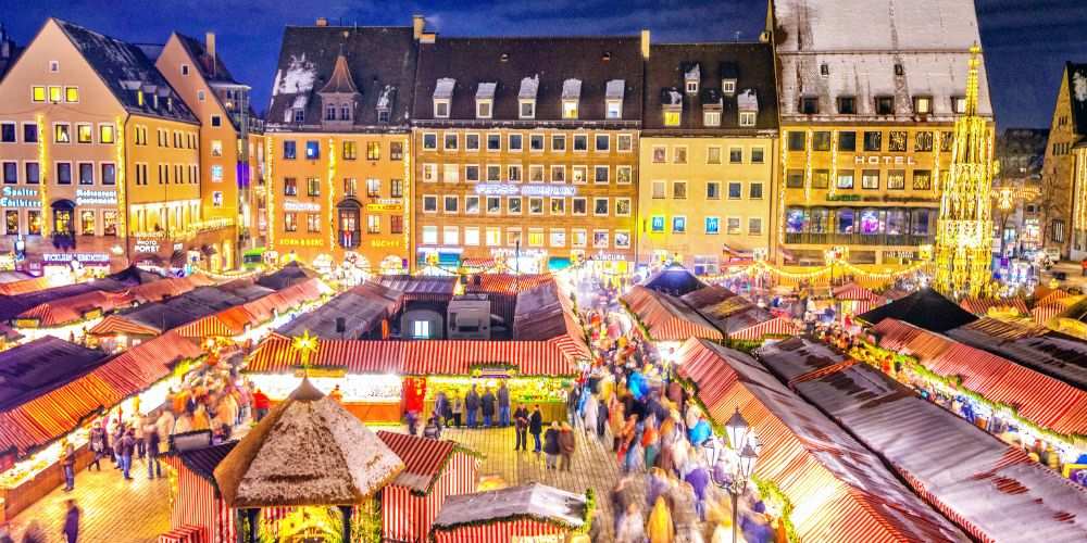 top view of a crowded market showing a building in the middle - best christmas markets in the world