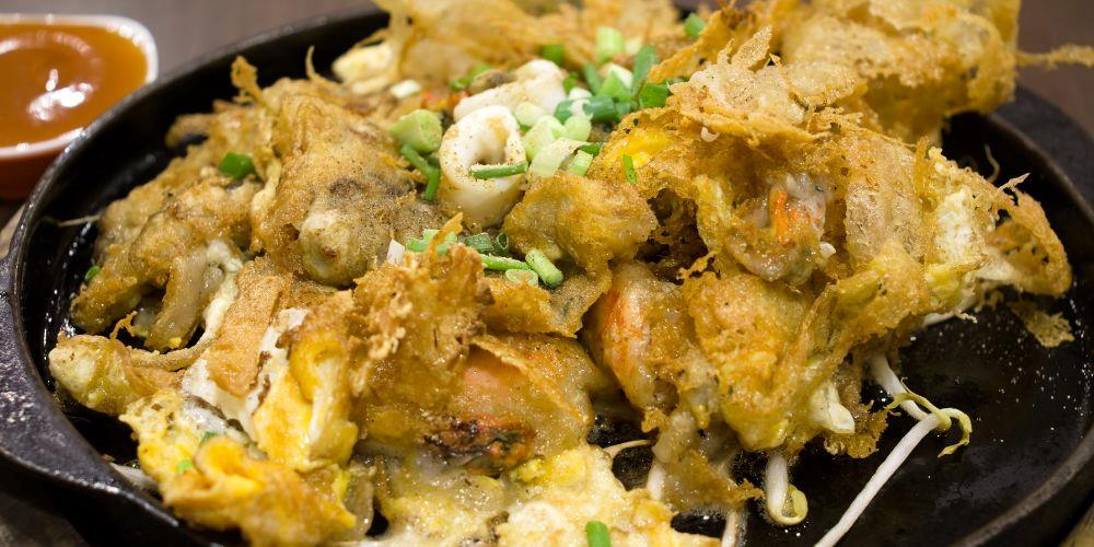 cooked mussels, eggs, bean sprouts, and green onions. - best thai food in thailand