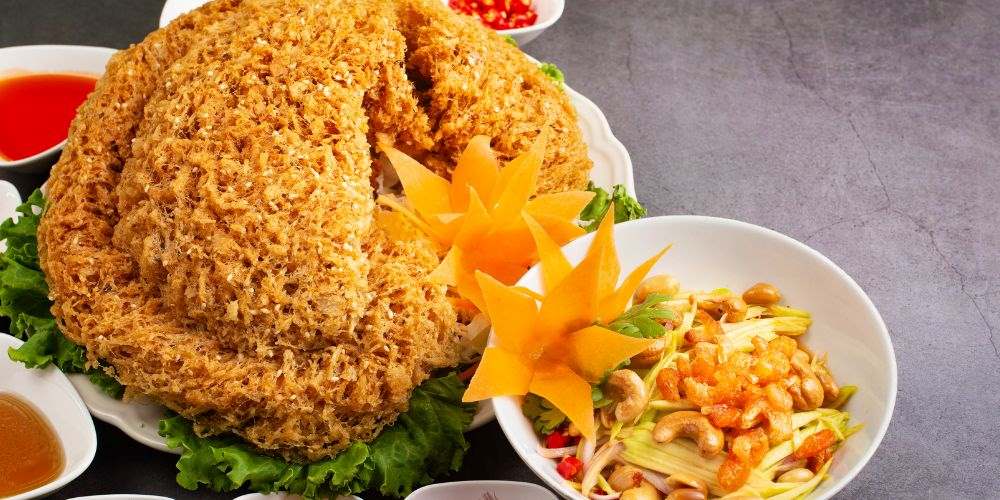 fried and crispy Catfish, green mango, and a medley of herbs and spices.