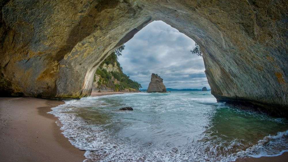 coastal formation forming cove - Things to do in New Zealand north island