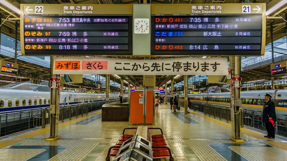underground trains with people walking and standing