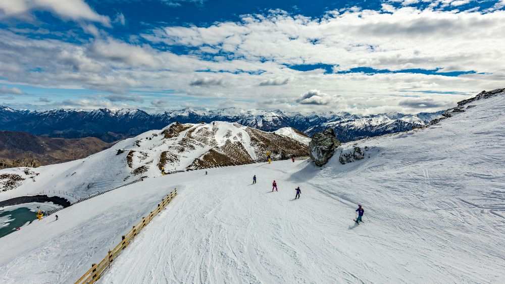 people on top of the mountain during winter