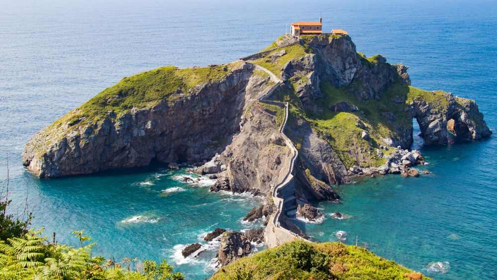 aerial view of a rocky island surrounded by body of water- Best road trips in Europe