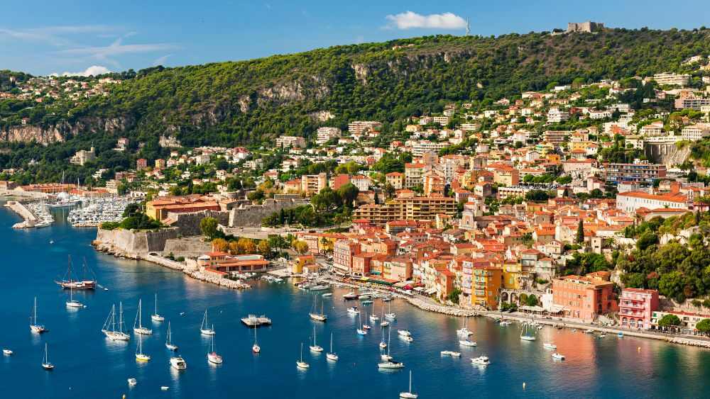 aerial view of a city near the ocean- Best road trips in Europe