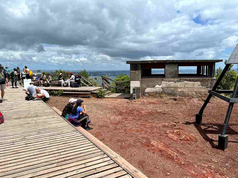 people sitting in a wooden walkway