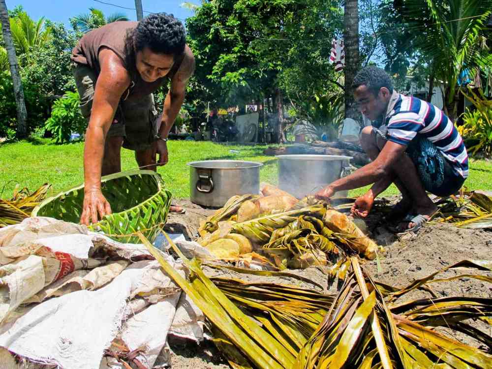 two men cooking food the natural way