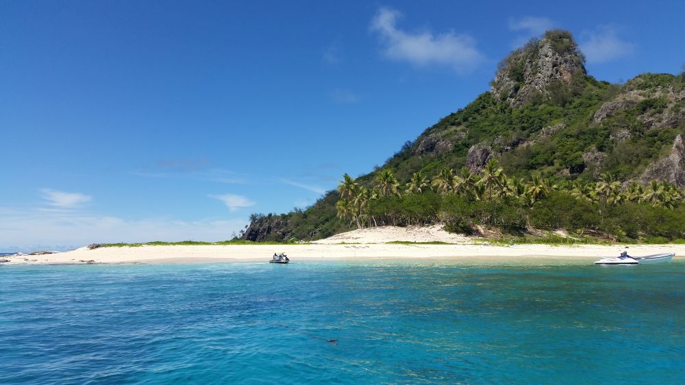 jetski and yatch in an island with no people